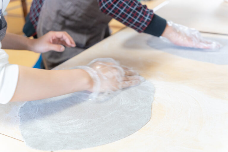 Rolling soba dough into thin sheet